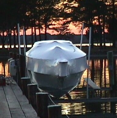 Wrapped Boat on Lift at Sunset