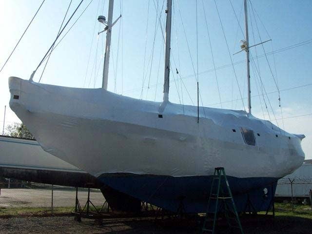 shrink wrapping a sailboat